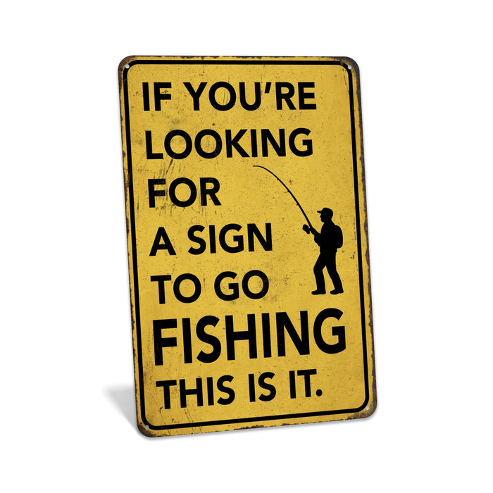 Yellow sign with black text and fishing graphic on a white background