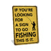 Yellow sign with black text and fishing graphic on a white background