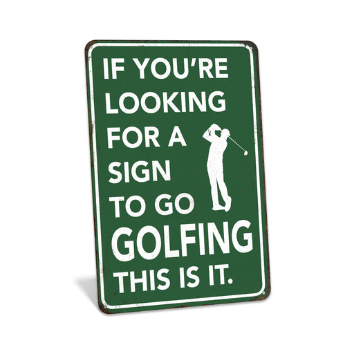 Rustic green metal golf sign reading If You're Looking for a Sign to Go Golfing This Is It with golfer silhouette