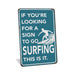 Rustic teal metal surfing sign reading If You're Looking for a Sign to Go Surfing This Is It with surfer on wave silhouette