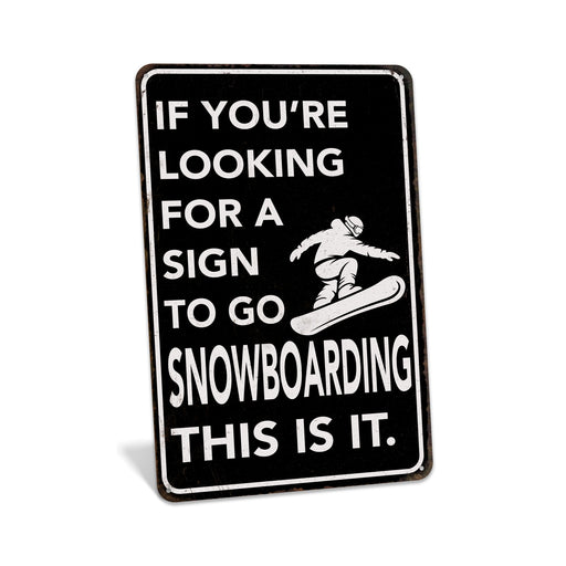Rustic black metal snowboarding sign reading If You're Looking for a Sign to Go Snowboarding This Is It with snowboarder silhouette