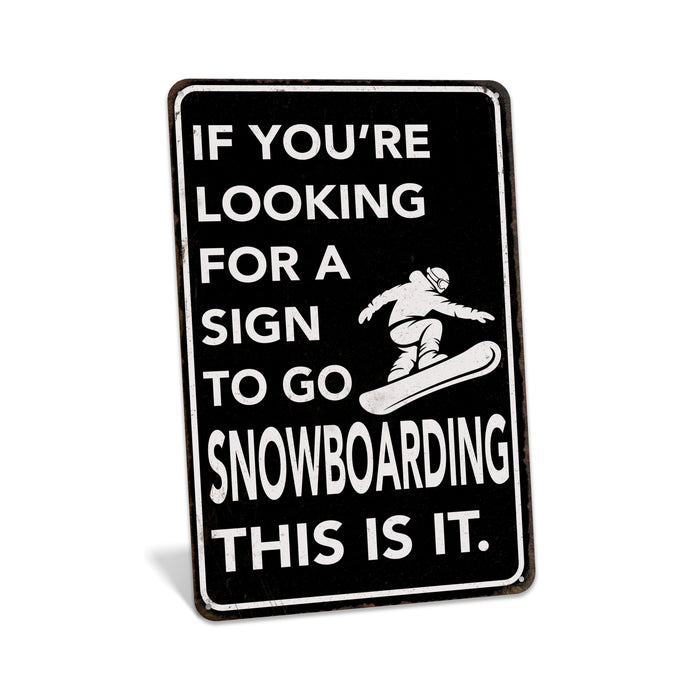 Rustic black metal snowboarding sign reading If You're Looking for a Sign to Go Snowboarding This Is It with snowboarder silhouette