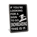 Rustic black metal snowboarding sign reading If You're Looking for a Sign to Go Snowboarding This Is It with snowboarder silhouette