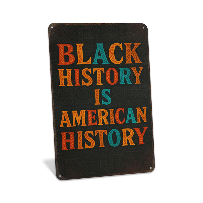 Rustic metal wall sign featuring bold typography reading “Black History Is American History” with a clean, cultural design for home or office décor.
