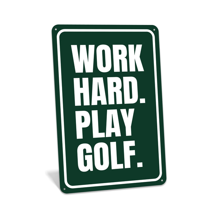 Rustic metal golf sign reading “Work Hard Play Golf,” styled as motivational golf décor.
