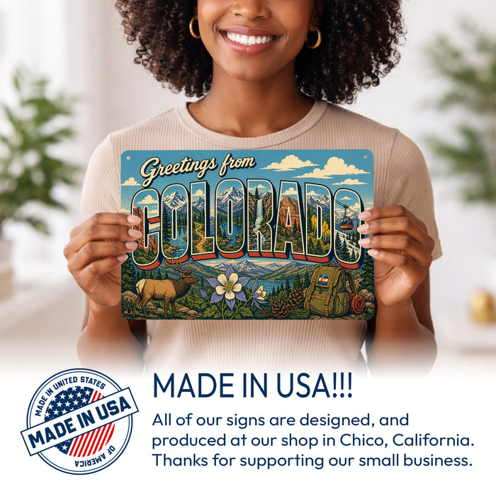 Greetings from Colorado metal sign with horizontal vintage 'Greetings from Colorado' large-letter postcard with Rocky
