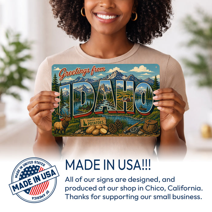 Greetings from Idaho metal sign with horizontal vintage 'Greetings from Idaho' large-letter postcard with Sawtooth