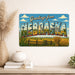 Greetings from Nebraska metal sign with horizontal vintage 'Greetings from Nebraska' large-letter postcard with Nebraska