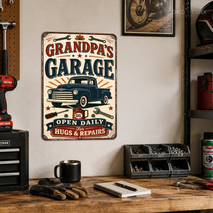 Grandpa's Garage Hugs and Repairs metal sign with vintage layout with blue Chevy classic pickup, crossed wrenches