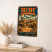 Bodie California State Historic Park metal sign with vintage weathered-tin travel poster illustration — Bodie California