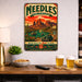 Needles California Route 66 Gateway Mojave metal sign with vintage weathered-tin travel poster illustration — Needles