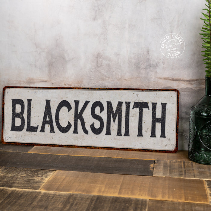 Blacksmith Vintage Look Black on White Metal Sign