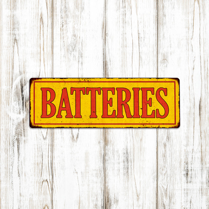 Batteries in Vintage Looking Metal Sign Shop Oil Gas Garage
